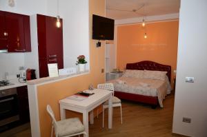 A bed or beds in a room at L'Orizzonte Relais Sirolo