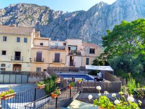 a group of buildings in front of a mountain at Can Misse in Collbató