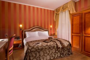 Postel nebo postele na pokoji v ubytování Hotel Forte
