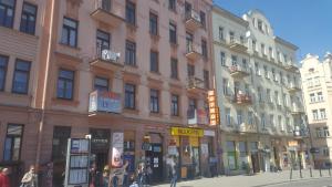 a group of buildings on a street in a city at Rodmos Hostel in Lublin