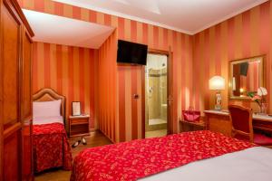 Postel nebo postele na pokoji v ubytování Hotel Forte
