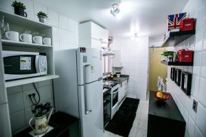 Kjøkken eller kjøkkenkrok på Lindo Apto Frente ao Mar