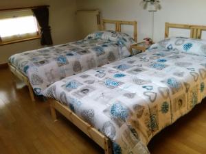 Postel nebo postele na pokoji v ubytování B&B Tisoi