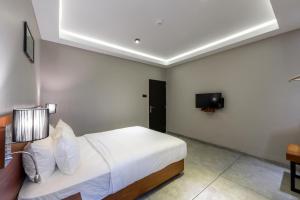 מיטה או מיטות בחדר ב-Fern Colombo