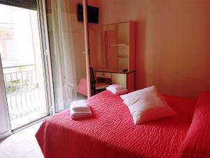 Postel nebo postele na pokoji v ubytování Hotel Giannella + 37 fotografií