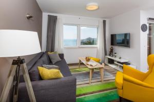 Televízia a/alebo spoločenská miestnosť v ubytovaní Villa Pergola-Apartment Toni