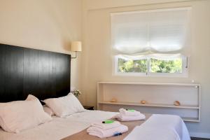 Postel nebo postele na pokoji v ubytování Hostal Jakiton