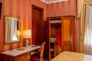 Postel nebo postele na pokoji v ubytování Hotel Forte