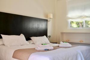 Postel nebo postele na pokoji v ubytování Hostal Jakiton