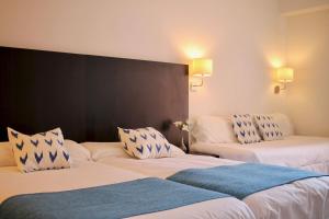 Postel nebo postele na pokoji v ubytování Hostal Jakiton