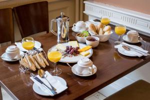 a table with breakfast foods and glasses of orange juice at Salthill Hotel in Galway