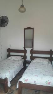 Ένα ή περισσότερα κρεβάτια σε δωμάτιο στο Casa da Tereza