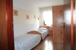 Albergo diffuso Valcellina e Val Vajont in Claut房間的床