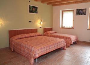 Albergo diffuso Valcellina e Val Vajont in Claut房間的床