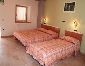 Albergo diffuso Valcellina e Val Vajont in Claut房間的床