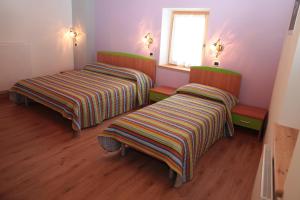 Albergo diffuso Valcellina e Val Vajont in Claut房間的床