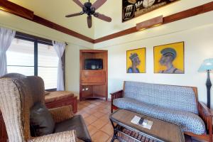 a living room with a couch and a table at Condo #22 @ Beachside Villas in Seine Bight Village