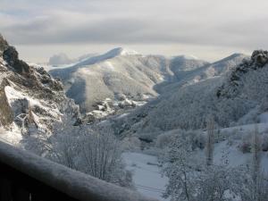 a view of a mountain valley covered in snow at La Posada de Cucayo in Dobres