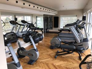 a gym with a bunch of exercise bikes in it at Marienlyst Apartment in Helsingør