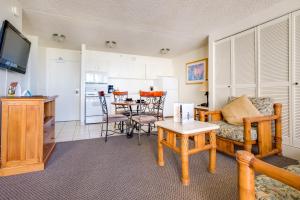 a living room with a couch and a table at Hawaiian Sun Holidays in Honolulu