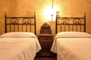 Cama o camas de una habitación en El Ventorro Hospederia Rural