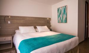 Voodi või voodid majutusasutuse Hotel Mae toas