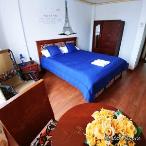 Postel nebo postele na pokoji v ubytování Hostal Arauco