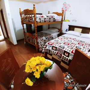 Postel nebo postele na pokoji v ubytování Hostal Arauco