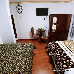Postel nebo postele na pokoji v ubytování Hostal Arauco