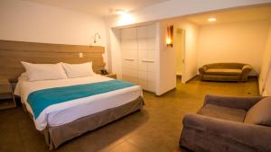 Voodi või voodid majutusasutuse Hotel Mae toas