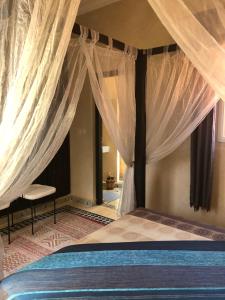 Postel nebo postele na pokoji v ubytování Riad Côté palmeraie + 22 fotografií