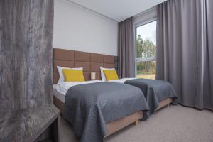 Postel nebo postele na pokoji v ubytování Blu Residence
