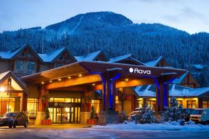 a large building with a ski lift on top of it at Aava Whistler Hotel in Whistler