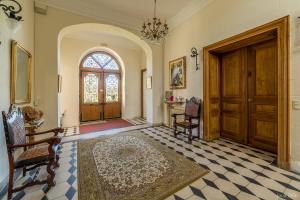 a room with a door and chairs and a rug at Château de Saint-Bohaire in Saint-Bohaire +35 photos