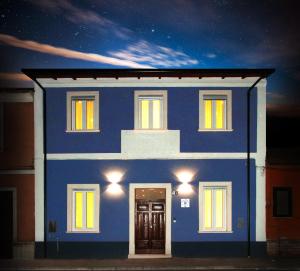 a blue house with lights on top of it at Relais Marlene in Avezzano