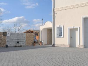 a white building with a door on the side of it at NM-APARTMENTS in Griesheim