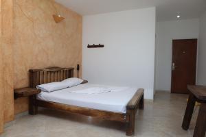 Postel nebo postele na pokoji v ubytování Hotel Anamichu Suites