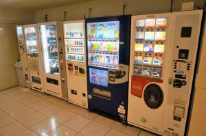 four vending machines are lined up next to each other at The Kato Hotel in Tokai
