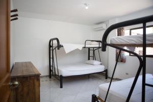 Postel nebo postele na pokoji v ubytování Hotel Anamichu Suites