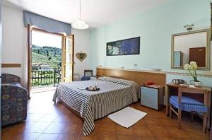 Postel nebo postele na pokoji v ubytování Albergo Ristorante San Matteo + 37 fotografií