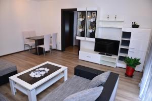 a living room with a couch and a table at Guesthouse Juka in Gospić