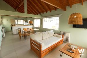 a living room with a couch and a table at Walwalun in Caviahue
