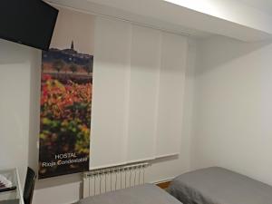Postel nebo postele na pokoji v ubytování Hostal Rioja Condestable