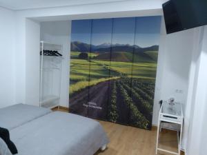 Postel nebo postele na pokoji v ubytování Hostal Rioja Condestable