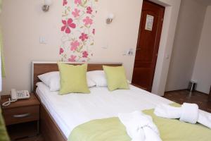 Voodi või voodid majutusasutuse Garni Hotel Laguna Lux toas