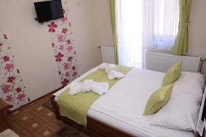 Voodi või voodid majutusasutuse Garni Hotel Laguna Lux toas