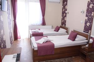 Voodi või voodid majutusasutuse Garni Hotel Laguna Lux toas