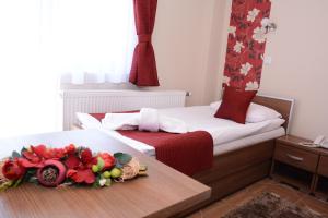 Voodi või voodid majutusasutuse Garni Hotel Laguna Lux toas