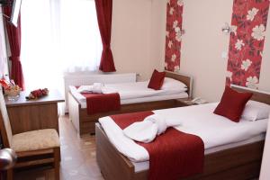 Voodi või voodid majutusasutuse Garni Hotel Laguna Lux toas