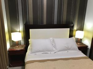 Ein Bett oder Betten in einem Zimmer der Unterkunft Ocio Apart